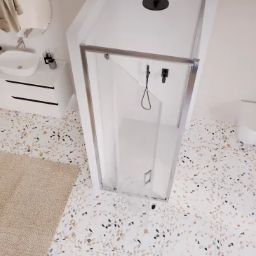 Zweiseitige Duschkabine mit feststehender Drehtür und ADELE-Tür